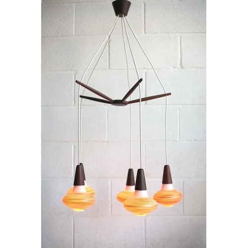 41 - A retro mid century 1960s Danish teak hanging ceiling light. The light having a five branch propelle... 