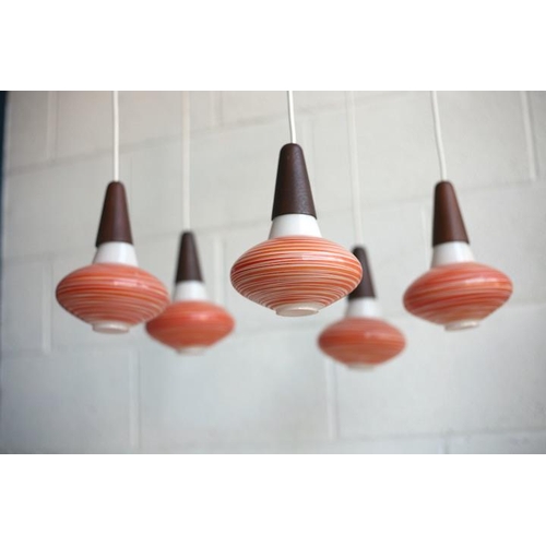 41 - A retro mid century 1960s Danish teak hanging ceiling light. The light having a five branch propelle... 