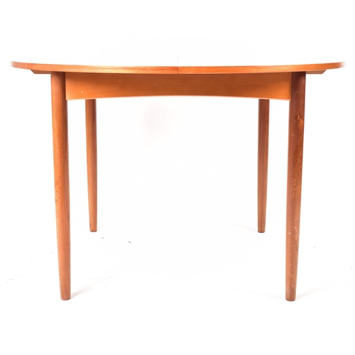 412 - G Plan - A retro mid 20th century 1960s teak wood dining table and matching eight chairs. The extend... 