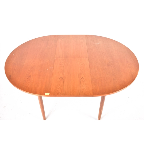 412 - G Plan - A retro mid 20th century 1960s teak wood dining table and matching eight chairs. The extend... 