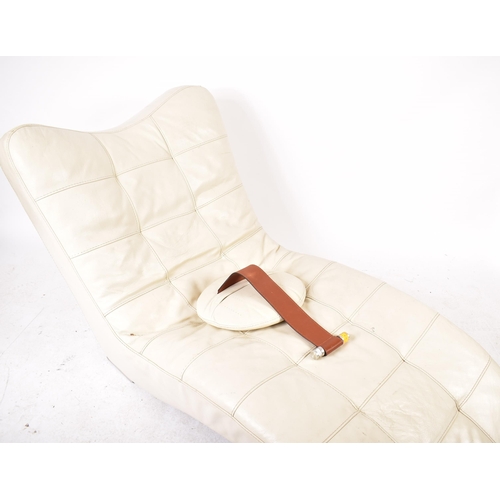 439 - A vintage likely Italian late 20th century white leather wave lounger. The lounge chair of waved for... 