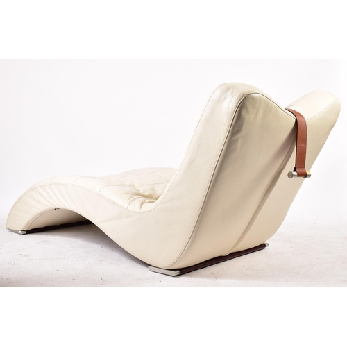 439 - A vintage likely Italian late 20th century white leather wave lounger. The lounge chair of waved for... 