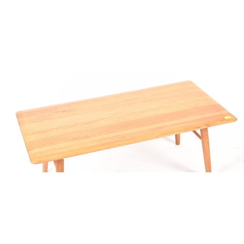 467 - A retro mid 20th century designer coffee table / low table. The table having an elm rectangular top ... 