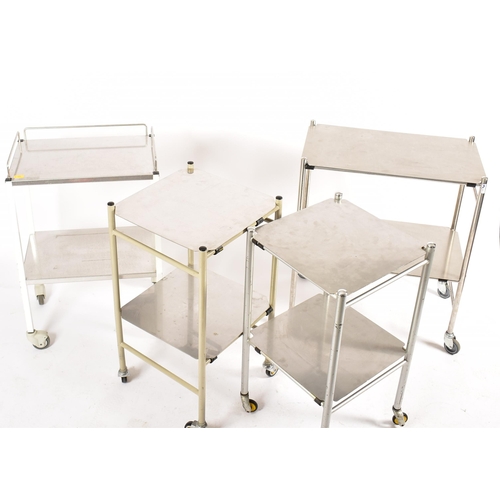 479 - A selection of four 20th century stainless steel medical / hospital trolleys. One trolley having two... 