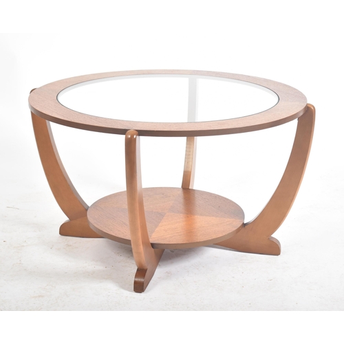 52 - A retro mid 20th century Art Deco influenced teak and glass coffee table / low table. The table havi... 