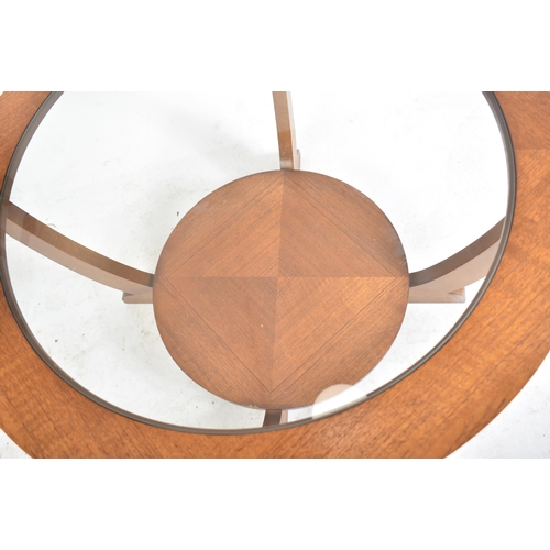 52 - A retro mid 20th century Art Deco influenced teak and glass coffee table / low table. The table havi... 