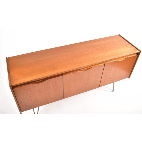 538 - A retro 20th century British designed teak wood sideboard credenza. The sideboard having three cupbo... 