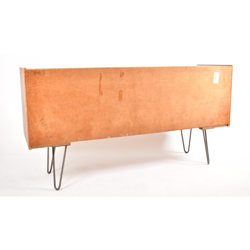 538 - A retro 20th century British designed teak wood sideboard credenza. The sideboard having three cupbo... 