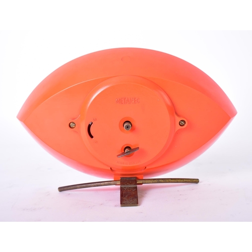 592 - Metamec - a vintage mid 20th century circa 1960s orange Bakelite atomic eye desk top clock. The cloc... 