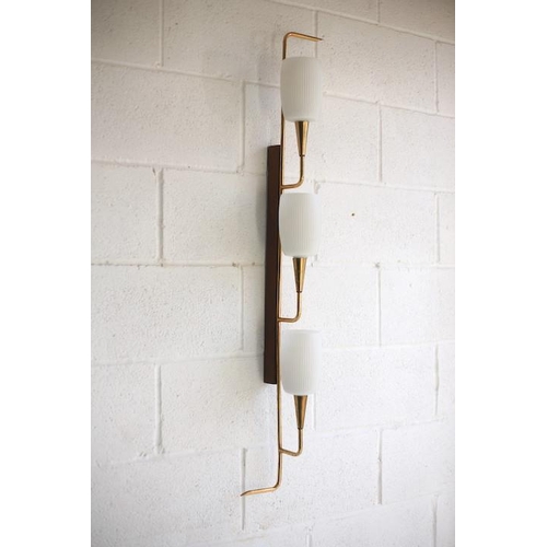 61 - A retro mid century 1950s triple French wall light. The light having a teak wall mount with shaped b... 