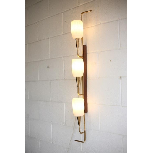 61 - A retro mid century 1950s triple French wall light. The light having a teak wall mount with shaped b... 