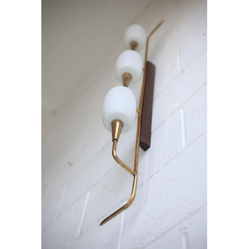 61 - A retro mid century 1950s triple French wall light. The light having a teak wall mount with shaped b... 