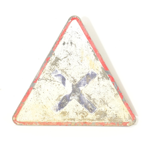 637 - A continental vintage late 20th century aluminium triangular road sign. With red edges and central b... 