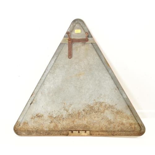 637 - A continental vintage late 20th century aluminium triangular road sign. With red edges and central b... 