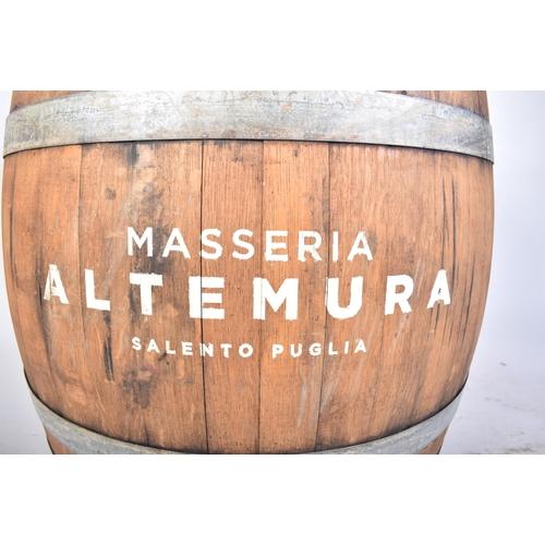 65 - A large vintage late 20th century iron bound wine barrel from ' Masseria Altemura ', Puglia, Italy. ... 