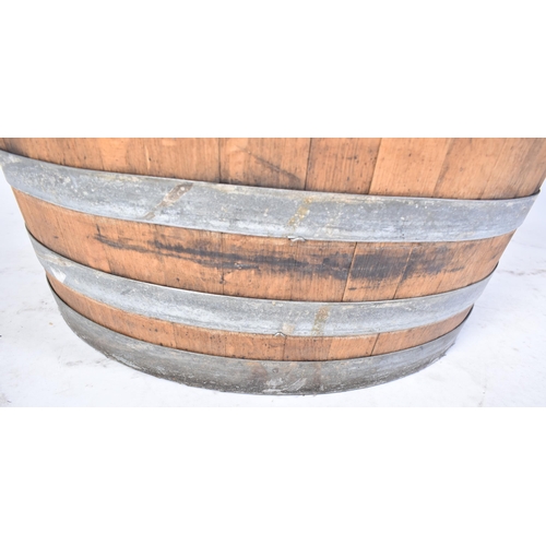 65 - A large vintage late 20th century iron bound wine barrel from ' Masseria Altemura ', Puglia, Italy. ... 