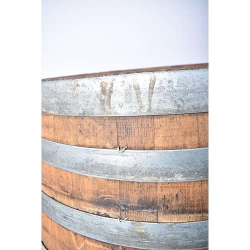 65 - A large vintage late 20th century iron bound wine barrel from ' Masseria Altemura ', Puglia, Italy. ... 