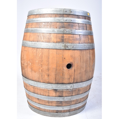 65 - A large vintage late 20th century iron bound wine barrel from ' Masseria Altemura ', Puglia, Italy. ... 