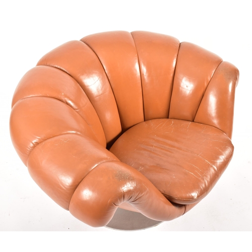 74 - A retro 20th century 1970s Art Deco influenced leather swivel lounge chair / armchair. The chair hav... 