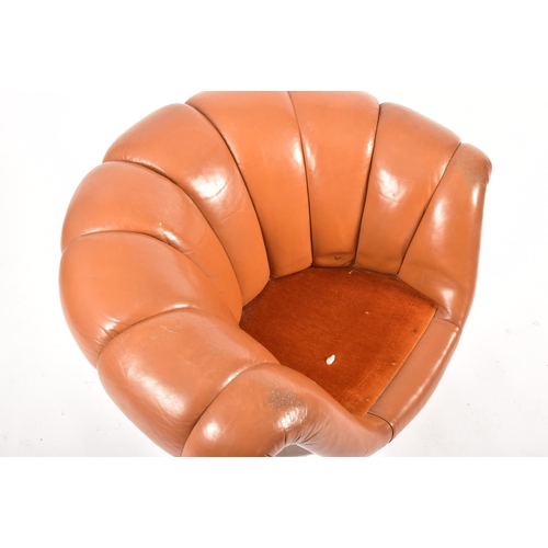 74 - A retro 20th century 1970s Art Deco influenced leather swivel lounge chair / armchair. The chair hav... 