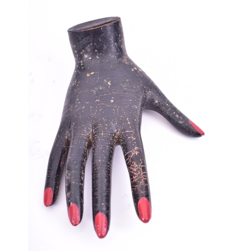 99 - A vintage mid 20th century point of display jeweller's advertising hand. The hand wooden and painted... 