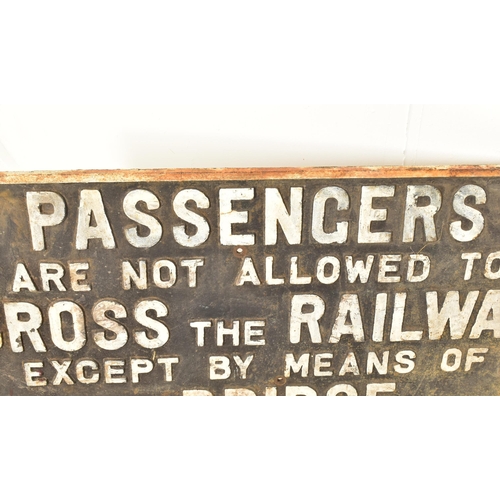 353 - Railwayana - A large vintage 20th century cast iron railway sign having raised lettering reading 'Pa... 