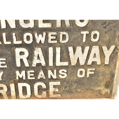 353 - Railwayana - A large vintage 20th century cast iron railway sign having raised lettering reading 'Pa... 