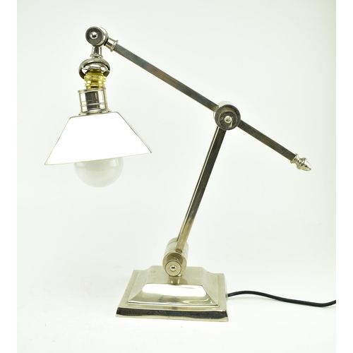 514 - A 20th century heavy chrome anglepoise counter balance table lamp - light. Square terraced base with... 