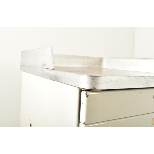 524 - A retro 20th century surgical / medical stainless steel and metal trolley. the trolley having a rais... 