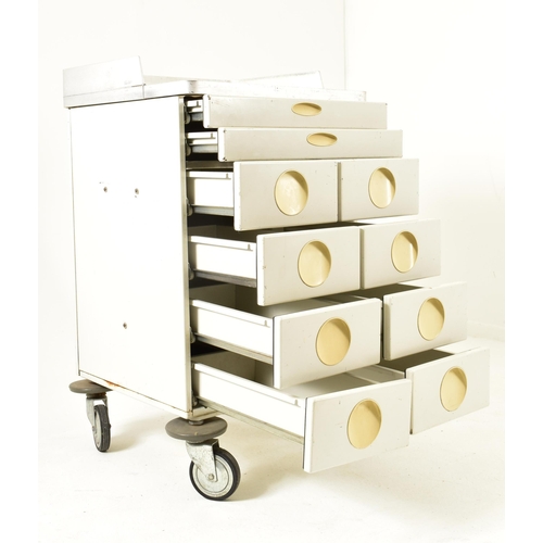 524 - A retro 20th century surgical / medical stainless steel and metal trolley. the trolley having a rais... 