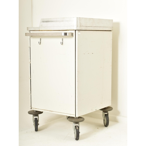 524 - A retro 20th century surgical / medical stainless steel and metal trolley. the trolley having a rais... 