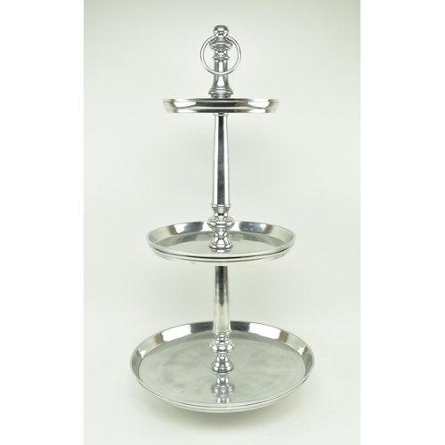 614 - A contemporary large three tier cake stand / food display stand. Central polished metal turned steam... 