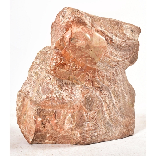 646 - A contemporary hand chiselled & polished pink marble conceptual floor sculpture statue. The sculptur... 