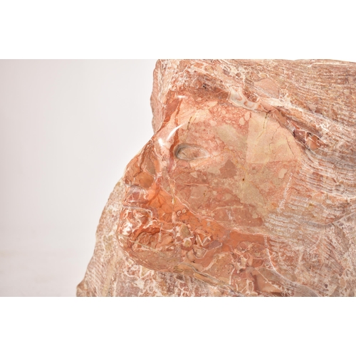 646 - A contemporary hand chiselled & polished pink marble conceptual floor sculpture statue. The sculptur... 