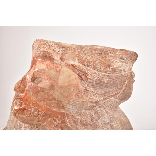 646 - A contemporary hand chiselled & polished pink marble conceptual floor sculpture statue. The sculptur... 