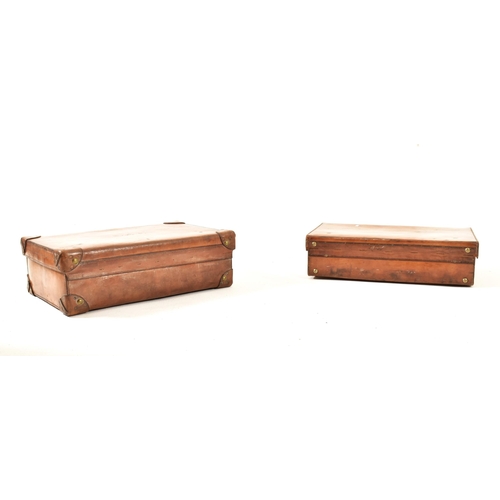 71 - A pair of vintage late 20th century pig skin leather travelling suitcases. Each suitcase of rectangu... 