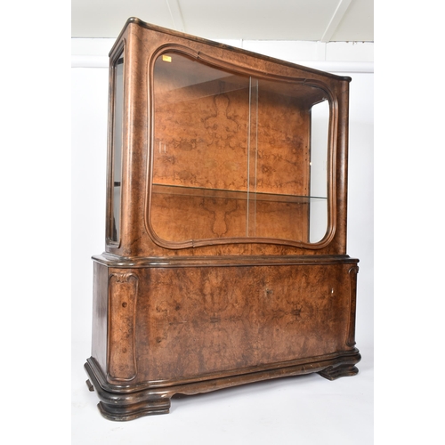 307 - A large  20th century 1930s continental Art Deco walnut veneer bookcase cabinet. The cabinet top hav... 