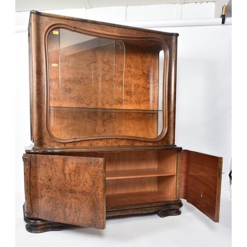 307 - A large  20th century 1930s continental Art Deco walnut veneer bookcase cabinet. The cabinet top hav... 