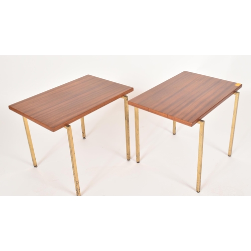 323 - A pair of retro mid 20th century teak & brass low occasional coffee tables. Each table having a rect... 