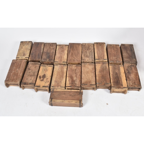 513 - A selection of nineteen mid 20th century industrial hardwood stacking brick moulds. Each mould iron ... 