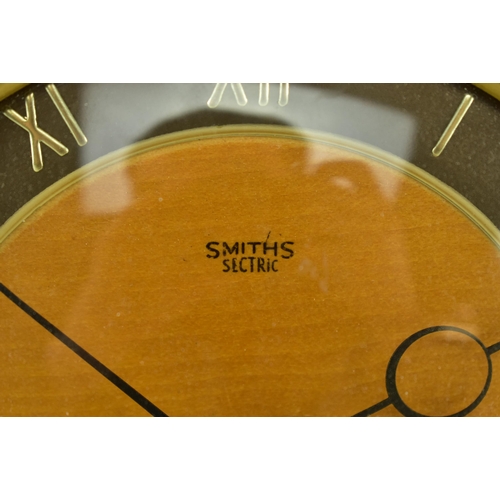 184 - Smiths Sectric - A vintage mid 20th century walnut mantel / desk clock. The clock raised on A-frame ... 