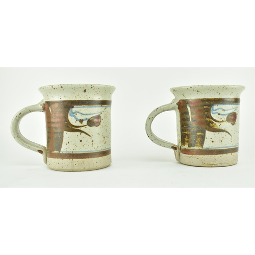 356 - Eden Pottery - A pair of 20th century studio art pottery cups. Each of typical form with abstract gl... 