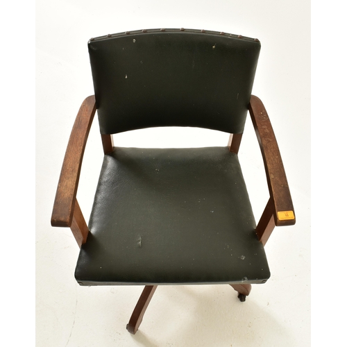 15 - Hillcrest - An early 20th century 1930s beech & green leather upholstered swivel office chair. The c... 