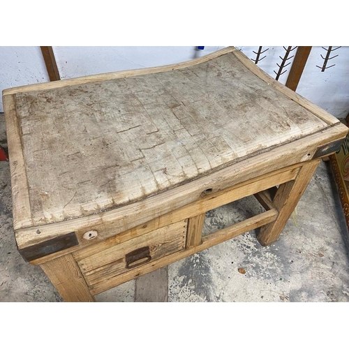 17 - An early 20th century large iron bound butcher's block. Raised on a chucky pine base set with a sing... 