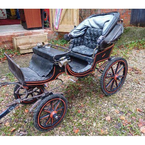 300 - A late 19th century Victorian child's four wheel dog / goat cart. The driver's seat flanked by a pai... 