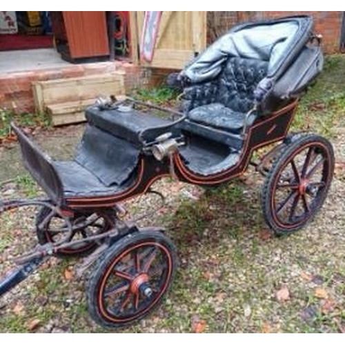 300 - A late 19th century Victorian child's four wheel dog / goat cart. The driver's seat flanked by a pai... 