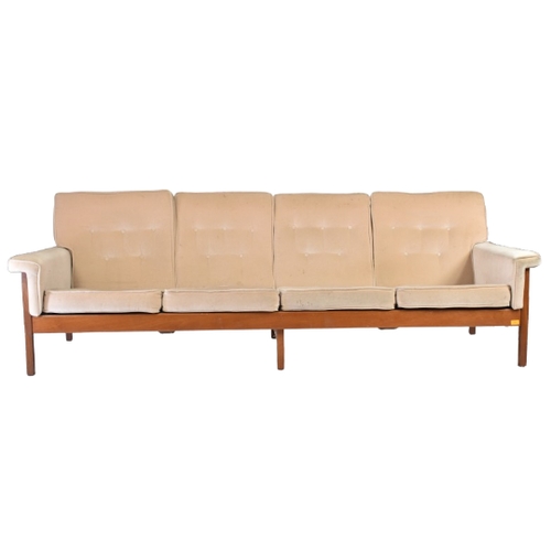 223 - Guy Rogers - A retro 20th century British design teak framed four seater sofa settee. The sofa with ... 