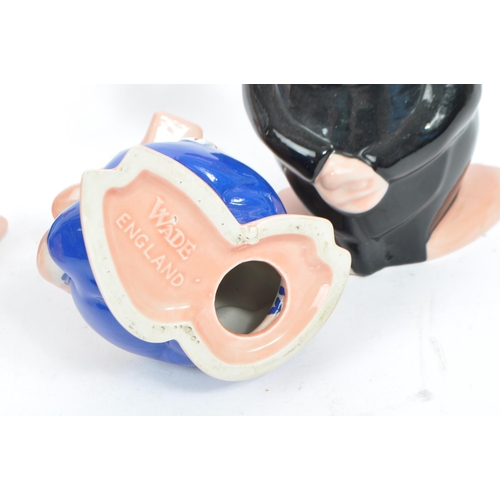 105 - Wade - A collection of five 20tgh century Wade ceramic Natwest pig money banks / piggie banks. Four ... 