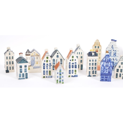 12 - A collection of miniature houses / flasks in blue Delft and other colours, hand painted and made in ... 