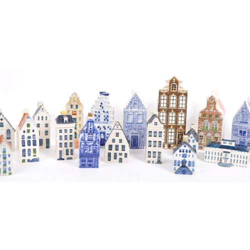 12 - A collection of miniature houses / flasks in blue Delft and other colours, hand painted and made in ... 